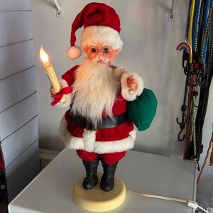 Red Santa Holiday Figurine with Green Sack